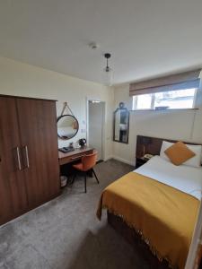 Letto o letti in una camera di Arnolds Hotel