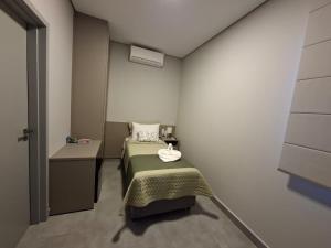 Ein Bett oder Betten in einem Zimmer der Unterkunft HOTEL JD cravinhos