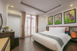 Postel nebo postele na pokoji v ubytování Quiet Sapa Hotel