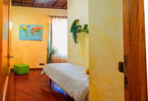 a bedroom with a bed in a room with a window at Un Posto al Centro in Manziana +26 photos