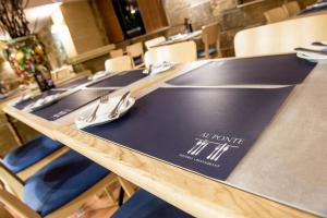 a table with napkins and utensils on it at Maritim Antonine Hotel & Spa in Mellieħa