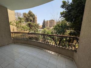 a balcony with a railing and a tile floor at Villa Maadi 35 -R 206 - Pool View Master Room in Cairo