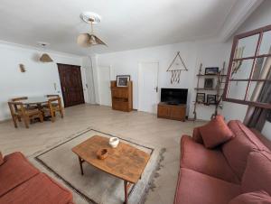 a living room with a couch and a table at Villa Maadi 35 -R 206 - Pool View Master Room in Cairo
