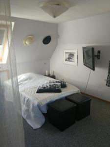 Voodi või voodid majutusasutuse Rooms4you toas