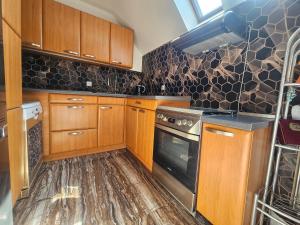 Kuchyň nebo kuchyňský kout v ubytování Apartmánovy dom Daniela