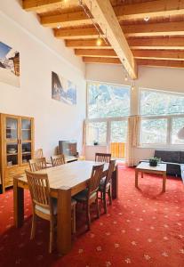 a dining room with a table and chairs at alpsrental Apartments Freja Obertauern in Obertauern
