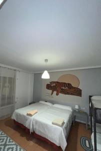 Cama o camas de una habitación en Roomin Hostel