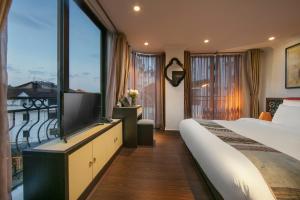 Postel nebo postele na pokoji v ubytování Quiet Sapa Hotel