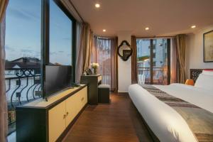 Postel nebo postele na pokoji v ubytování Quiet Sapa Hotel + 37 fotografií