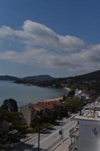 a view of a town with a river and a city at Fotini's studio in Paleo Tsifliki