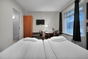 Postel nebo postele na pokoji v ubytování Hotel Varde