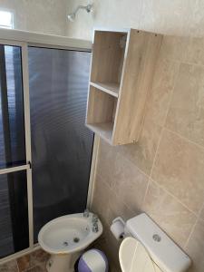 a small bathroom with a sink and a toilet at Departamentos Belgrano in San Luis