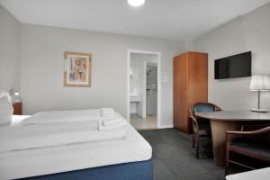 Postel nebo postele na pokoji v ubytování Hotel Varde
