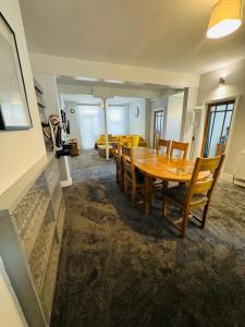 a dining room with a wooden table and chairs at The Anchor in Trowbridge +18 photos