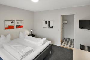 Postel nebo postele na pokoji v ubytování Hotel Varde