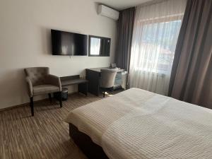 TV a/nebo společenská místnost v ubytování Hotel Divan