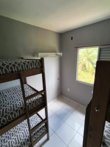 Postel nebo postele na pokoji v ubytování Hostel paid'egua