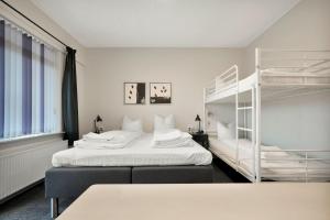 Postel nebo postele na pokoji v ubytování Hotel Varde