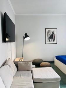 TV o dispositivi per l'intrattenimento presso Athenian Suite by Zeussuites
