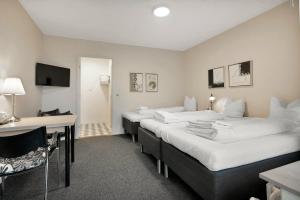 Postel nebo postele na pokoji v ubytování Hotel Varde