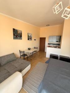 a living room with a bed and a table at Imperia in Bar