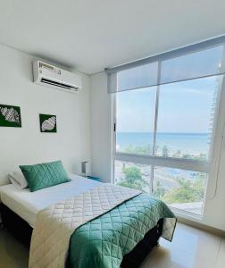Postel nebo postele na pokoji v ubytování Modern Condo at Seaside Luxury Resort