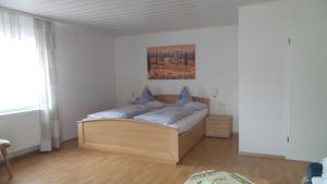a bedroom with a bed in a room at Gästehaus Reither in Schweigen-Rechtenbach