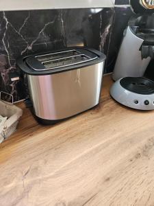 a toaster sitting on a counter next to a blender at L'Inattendu Love Room in Gardanne