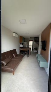 a living room with a couch and a table at Casa cocais Atins in Barreirinhas
