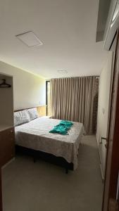 a bedroom with a bed and a window at Casa cocais Atins in Barreirinhas +7 photos