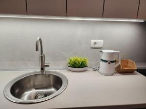 Η κουζίνα ή μικρή κουζίνα στο Harmony Apartments