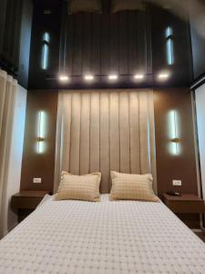 Ένα ή περισσότερα κρεβάτια σε δωμάτιο στο Harmony Apartments