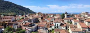 a view of a town with houses and the ocean at Mar Art Sapri in Sapri