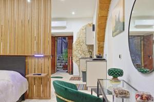 a bedroom with a bed and a table and chairs at Casa Damarete in Agrigento