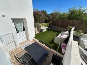 Jardin de l'établissement Appart T2 calme aux terrasses de Cassis
