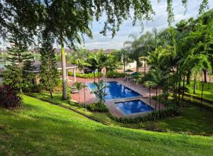 an overhead view of a swimming pool in a yard at Ecuabook Via a la Costa Gye Puerto Azul in Guayaquil