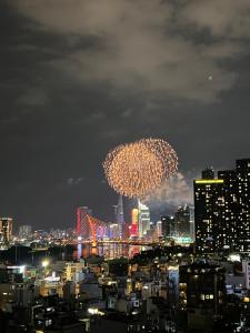 a view of a city at night with fireworks at Diny Aparthotel - Rooftop Pool - The Manor 2 in Ho Chi Minh City