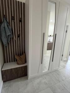 a bathroom with a large mirror and a shower at Арман комфорт in Aktobe +14 photos