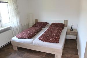 Postel nebo postele na pokoji v ubytování Chalupa pod Lysou horou