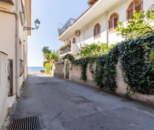 an empty street in front of a building at Casa del Marinaio in Nizza di Sicilia