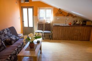 a living room with a couch and a table at Piano apartments in Kotor