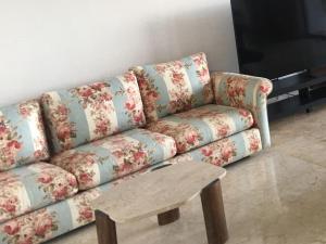 a couch in a living room with a coffee table at Authentique Berbère in Agoulzi