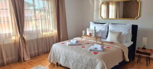 a bedroom with a bed with two towels on it at aNNa s Cozy Home with Private Forest, Canopy Terrace & Parking, near Red Bull Ring in Sankt Michael in Obersteiermark
