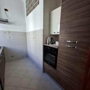 a kitchen with a sink and a stove at Domus Nicolaus in Giovinazzo +21 photos