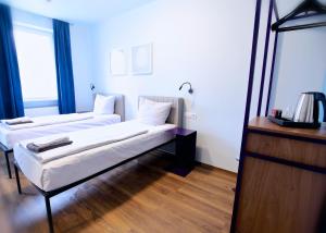 Postel nebo postele na pokoji v ubytování Das Schreder Hotel