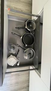 a kitchen with pots and pans in a refrigerator at Residenza Stardust Suite with Canal View in Venice