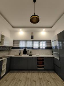 a kitchen with a sink and a counter top at Live On Cloud 9 at Kochi in Kakkanad