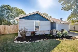 a blue house with a garden in front of it at 3 bed, close to Stadiums & Park, Big Yard in McKinney