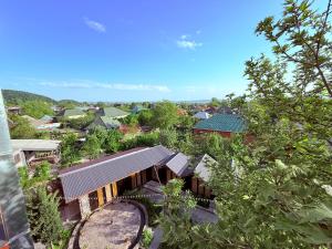 an overhead view of a house with trees and buildings at Elit Hostel Qabala in Gabala