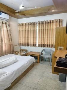 Postel nebo postele na pokoji v ubytování Hotel Dhanmondi Residential